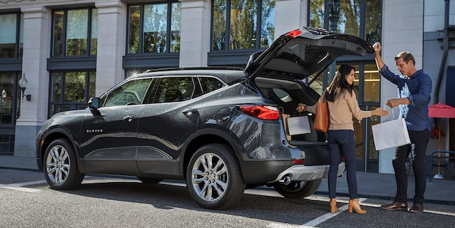Image of a family packing up the trunk of their Gray 2022 Chevrolet Blazer.