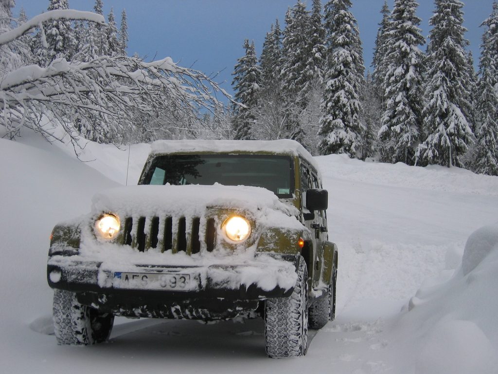 A jeep covered in snow.